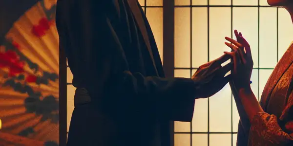 An intimate scene depicting a dramatic encounter between characters in traditional and modern attire, set against Japanese architecture.
